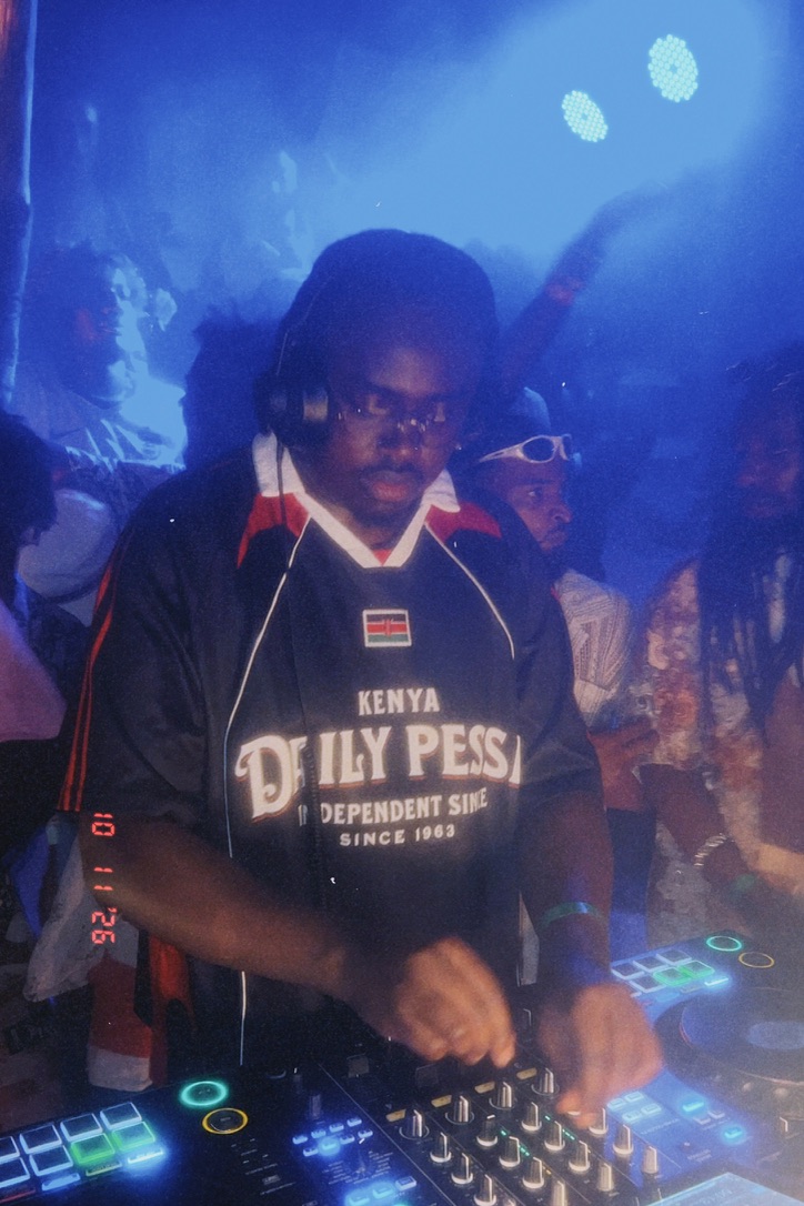 Burugu DJing behind the decks in a Kenya jersey